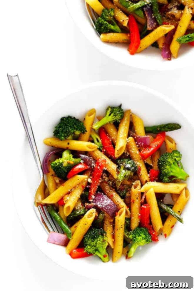 Close-up shot of Balsamic Veggie Pasta, highlighting the perfectly coated pasta and colorful vegetables, topped with fresh Parmesan.