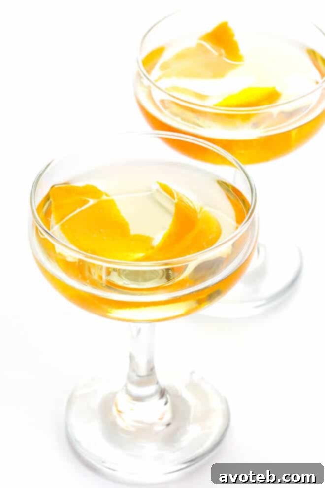Oaxacan Rusty Nail cocktail with mezcal, Drambuie, orange bitters, and jalapeño - a perfect blend of smoky, spicy, citrusy, and sweet flavors.