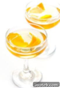 The Oaxacan Rusty Nail cocktail, a smoky mezcal drink with Drambuie, orange bitters, and jalapeño, served in a glass.