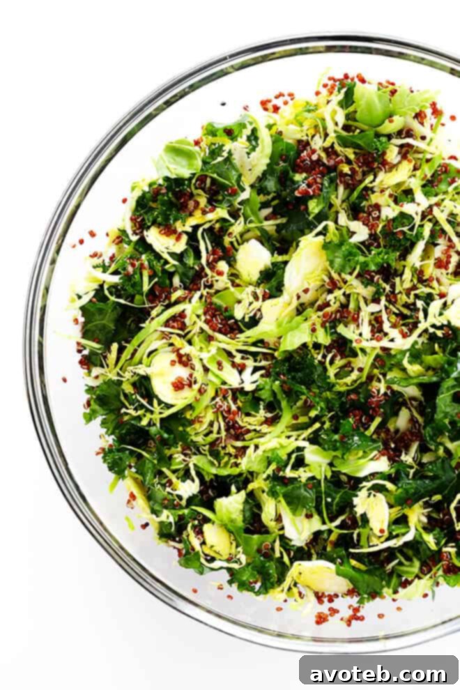 Close-up of the Hummus and Veggies Breakfast Bowl ingredients, highlighting the fresh asparagus, kale, and Brussels sprouts.