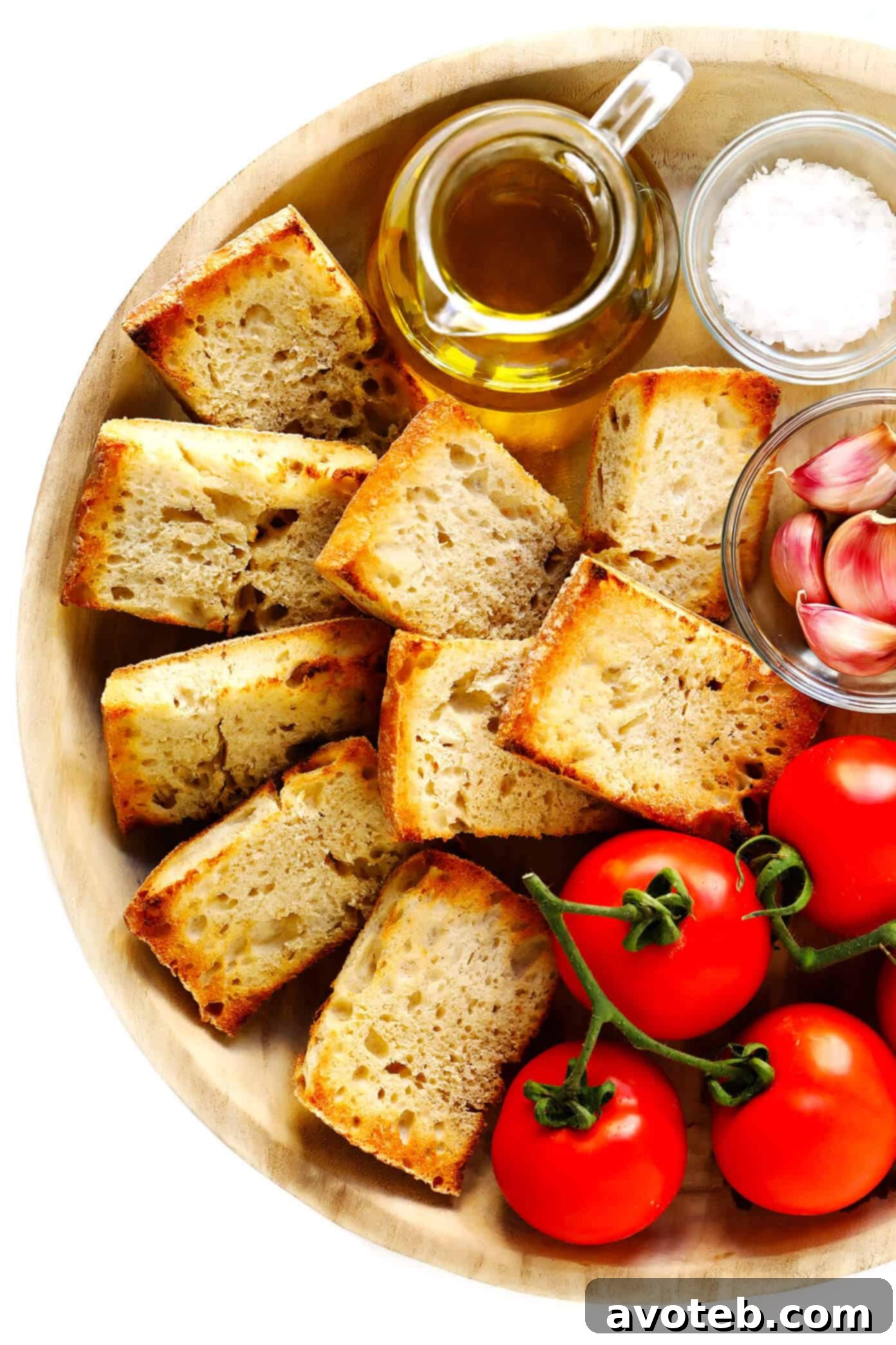 This Catalan Tomato Bread recipe is easy to make with just 5 ingredients, it's a great easy appetizer, side dish, or tapas recipe, and always tastes so fresh and delicious! | gimmesomeoven.com #tapas #spain #spanish #catalan #appetizer #bread #vegetarian #vegan Fresh ingredients for Pan Con Tomate: sliced bread, garlic, ripe tomatoes, olive oil, and sea salt.