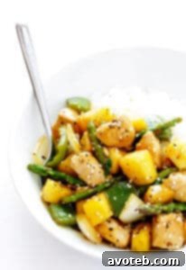 Vibrant Pineapple Ginger Chicken Stir-Fry in a wok.
