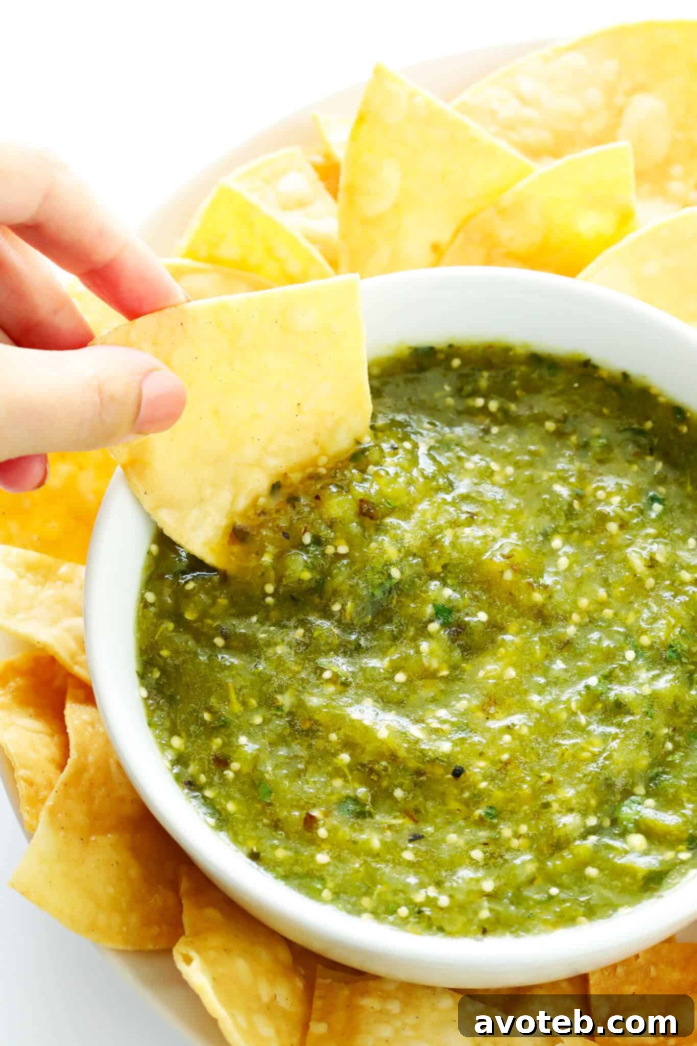 Freshly made salsa verde in a blender, ready to be poured and served.