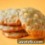 Freshly baked Oatmeal Cookies with Dried Apricots and White Chocolate on a cooling rack