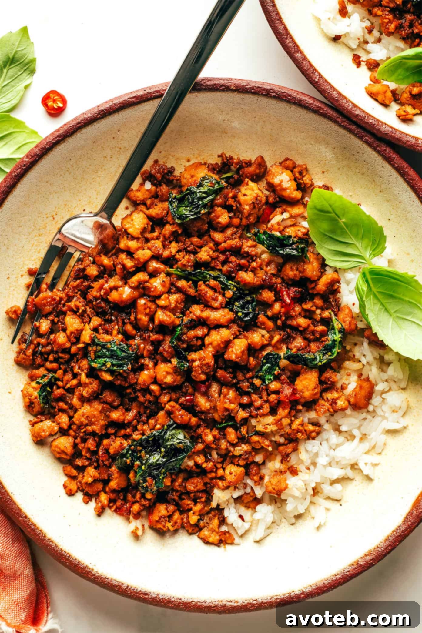 A close-up of finished Thai Basil Chicken with rice