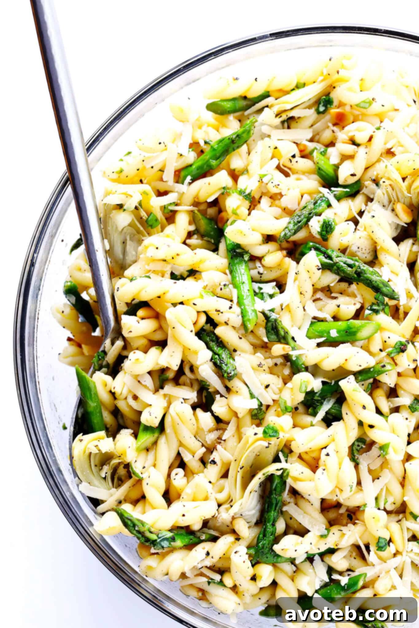 This Lemony Artichoke Pasta Salad recipe is quick and easy to make ahead, tossed with a delicious lemon-basil vinaigrette, and perfect for a picnic or potluck! | gimmesomeoven.com