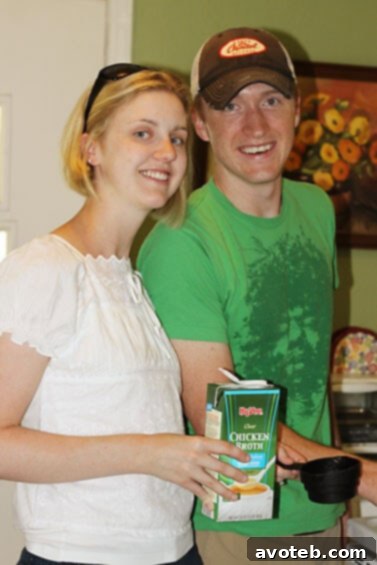 Two people, possibly sisters and brother-in-law, engaged in preparing Moroccan chicken pie