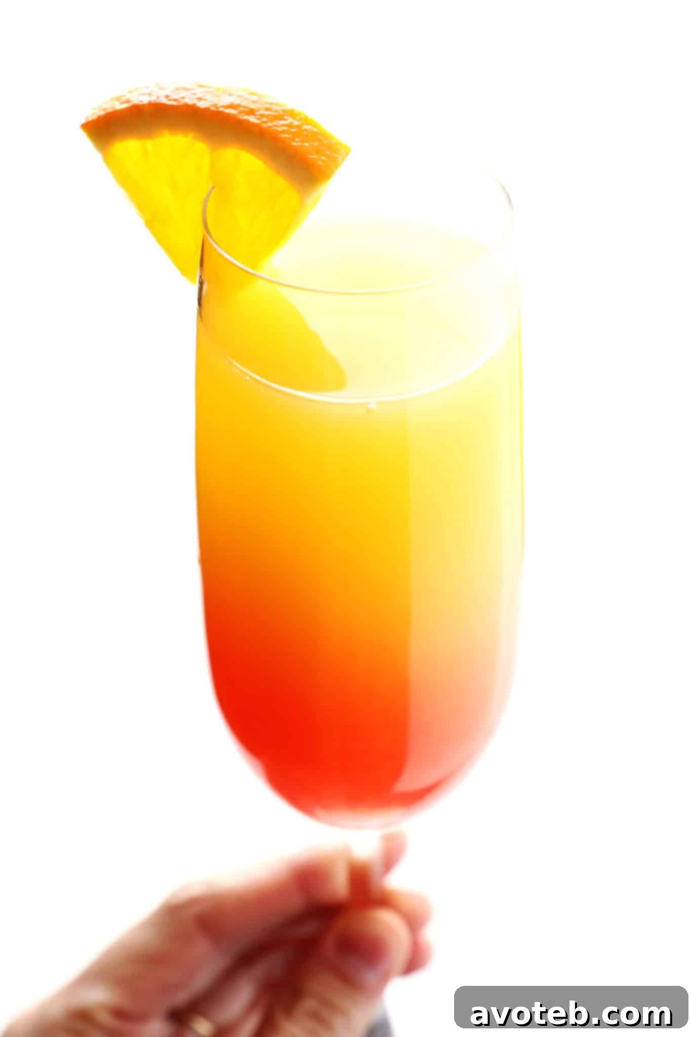 Agave Sunrise Mimosa 8 Several Tequila Sunrise Mimosas served in champagne flutes on a tray, ready for a brunch celebration.