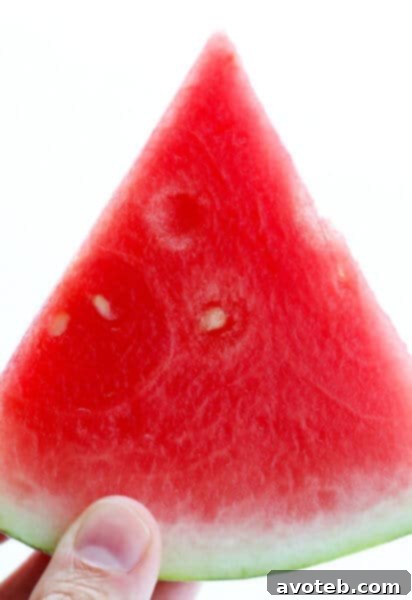 Watermelon being cut into cubes