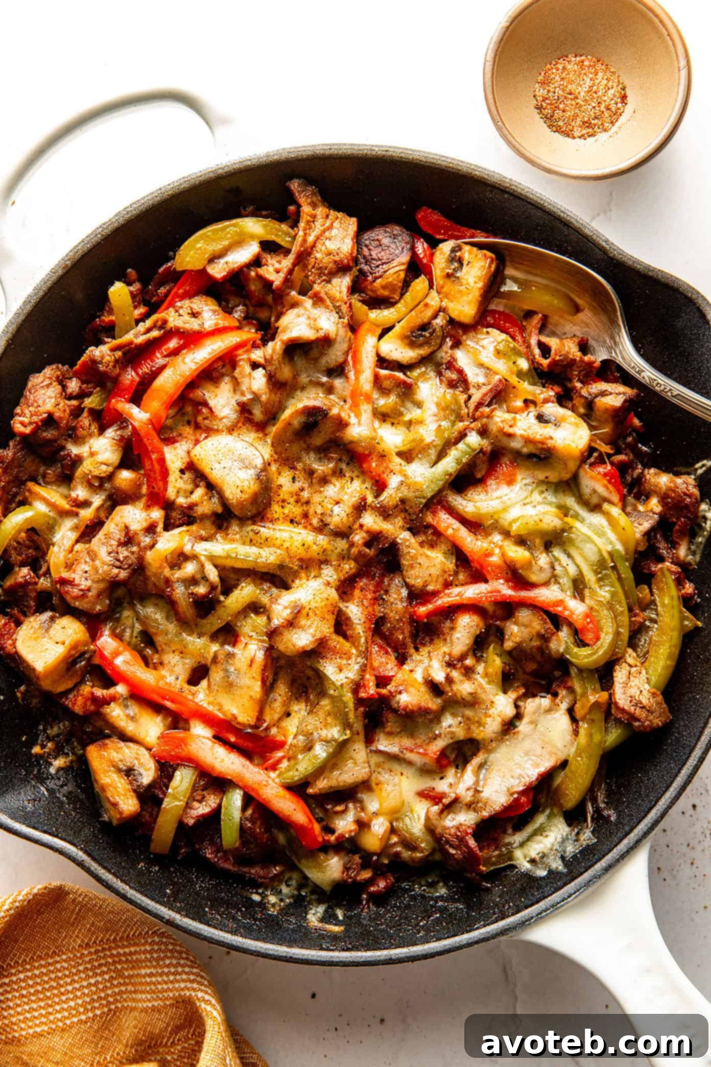 Cut Bell Peppers Like a Pro 6 A vibrant Zesty Philly Cheesesteak Skillet, showcasing bell peppers.