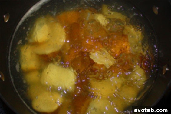 Wasabi Smashed Potatoes Close-up of Wasabi Smashed Potatoes in a bowl with a spoon.