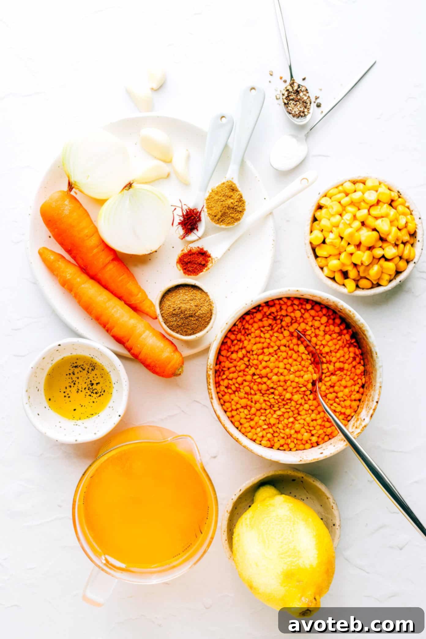 Lentil Soup Ingredients laid out on a kitchen counter, showcasing fresh vegetables and spices.