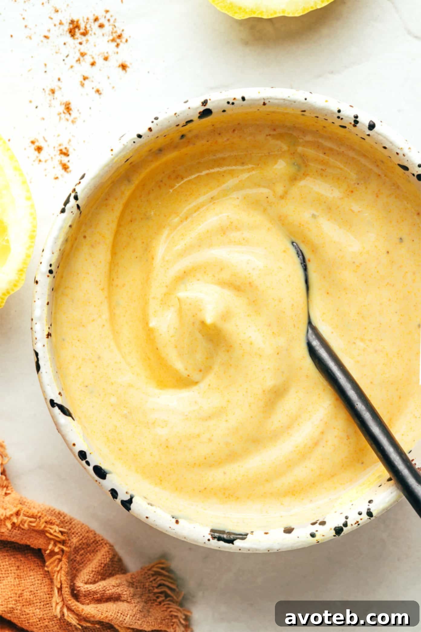 Close-up of the Greek yogurt curry sauce being prepared in a bowl.