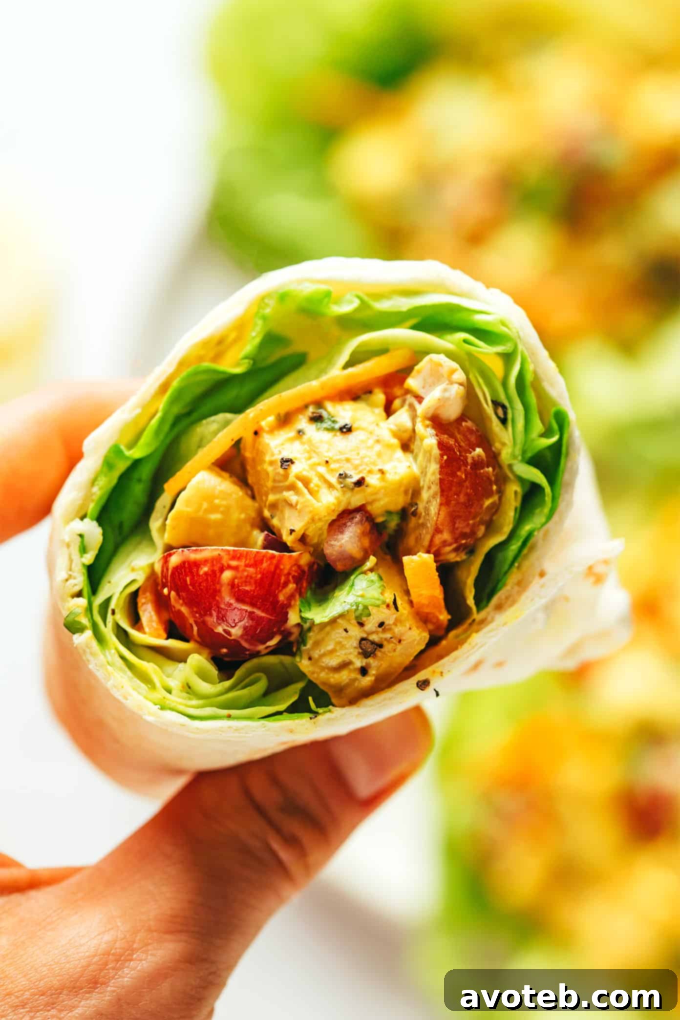 A delicious curry chicken salad wrapped in a tortilla, perfect for a quick and flavorful meal.