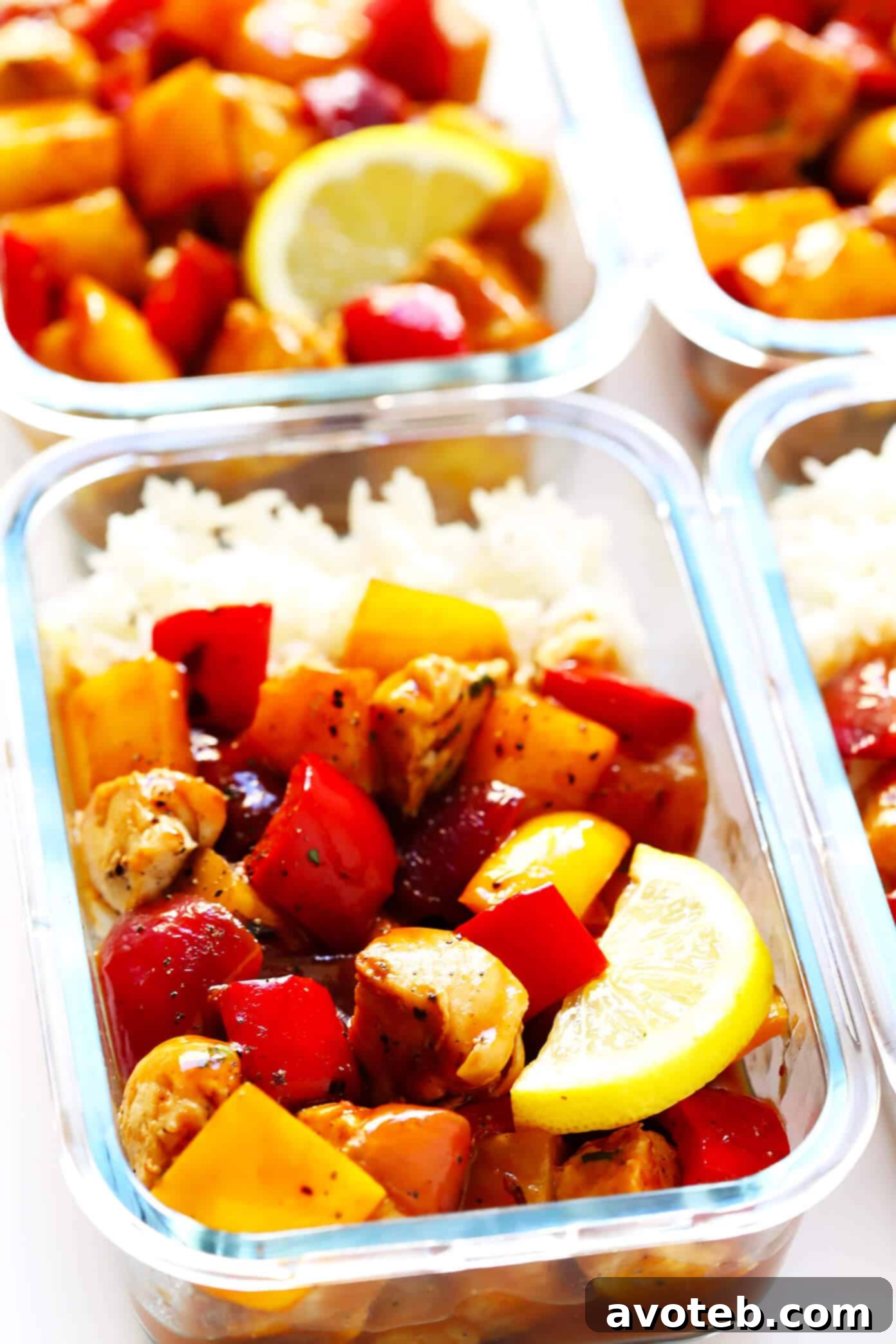 Hawaiian BBQ Chicken Bowl served over a bed of rice, showcasing the vibrant chicken, pineapple, and vegetables. A perfect balance of sweet and savory flavors for any meal. | Gimme Some Oven #mealprep #bbqchicken #healthychicken #chickenrecipes