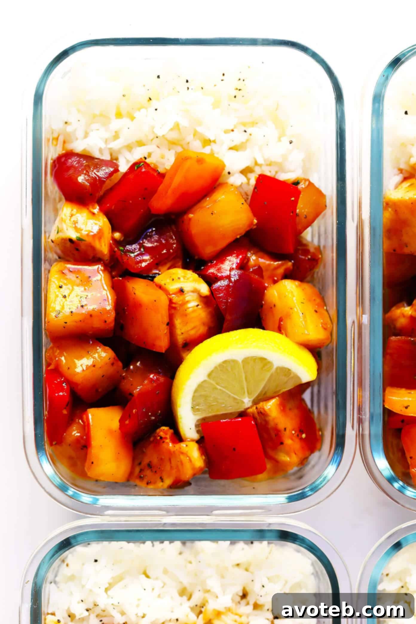 Meal prep containers filled with Hawaiian BBQ Chicken Bowls, ready for the week. A convenient and nutritious option for busy individuals seeking easy, healthy meals. | Gimme Some Oven #mealprep #bbqchicken #healthychicken #chickenrecipes