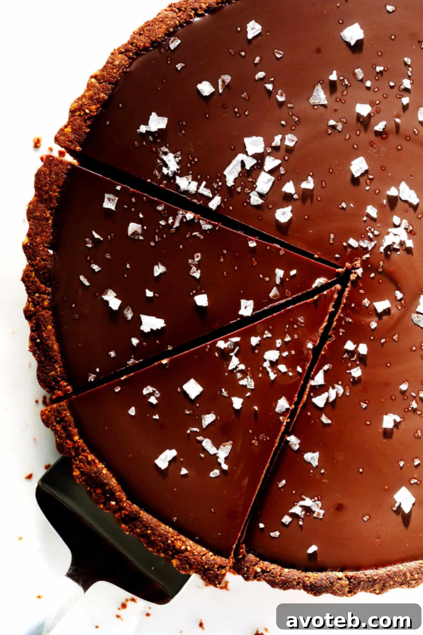 A perfectly chilled and set Salted Dark Chocolate Tart, presented beautifully in its pan, ready for its final touch.