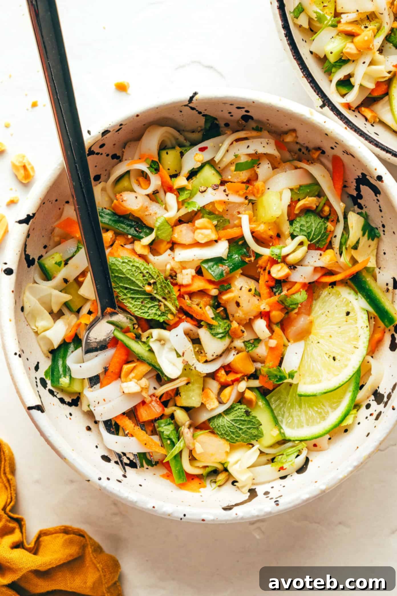 Deconstructed Vietnamese Spring Roll Bowl 2 Fresh Vietnamese Spring Roll Salad with vibrant vegetables and noodles.