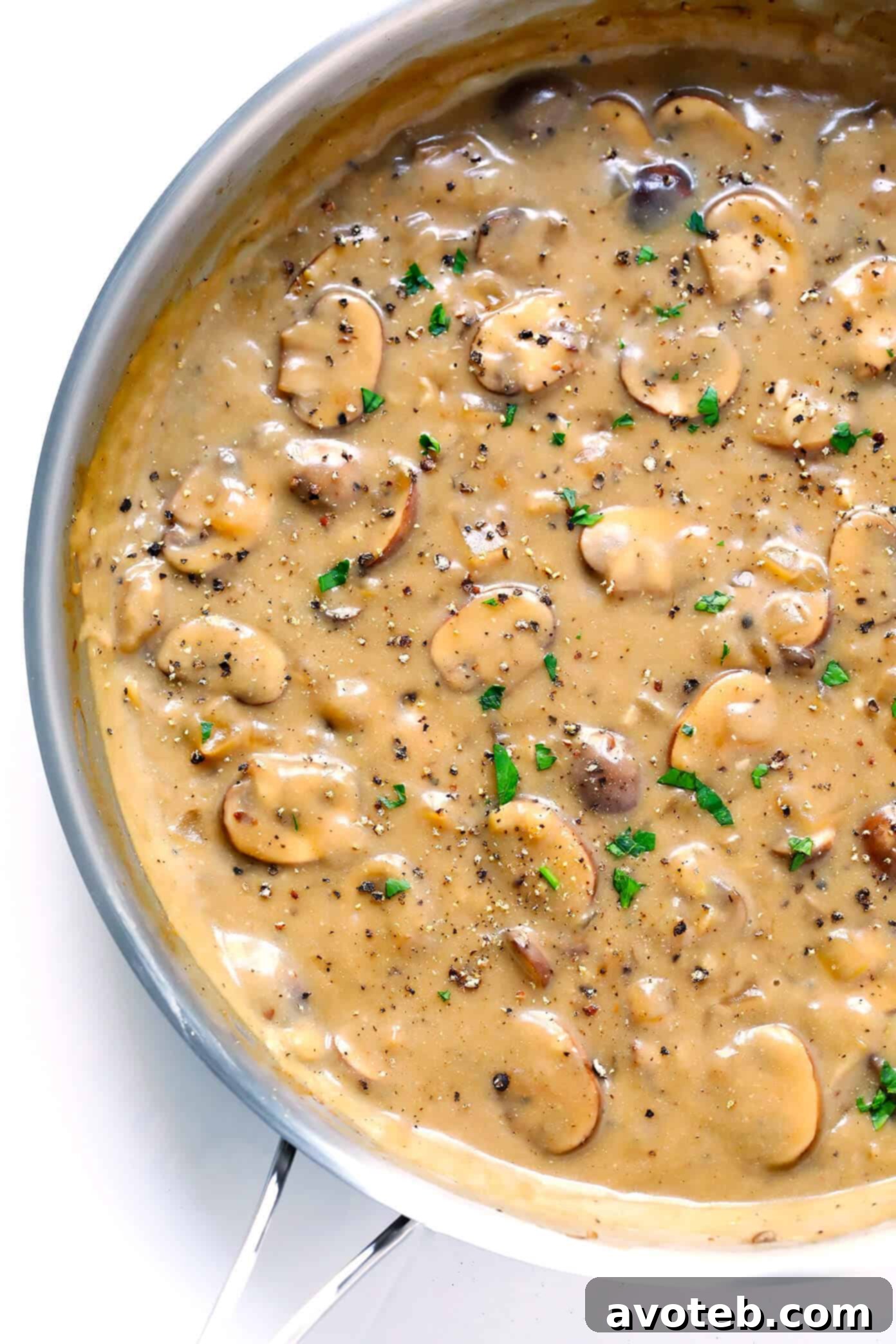 Close-up of the rich and creamy Vegetarian Mushroom Stroganoff sauce in a pan.