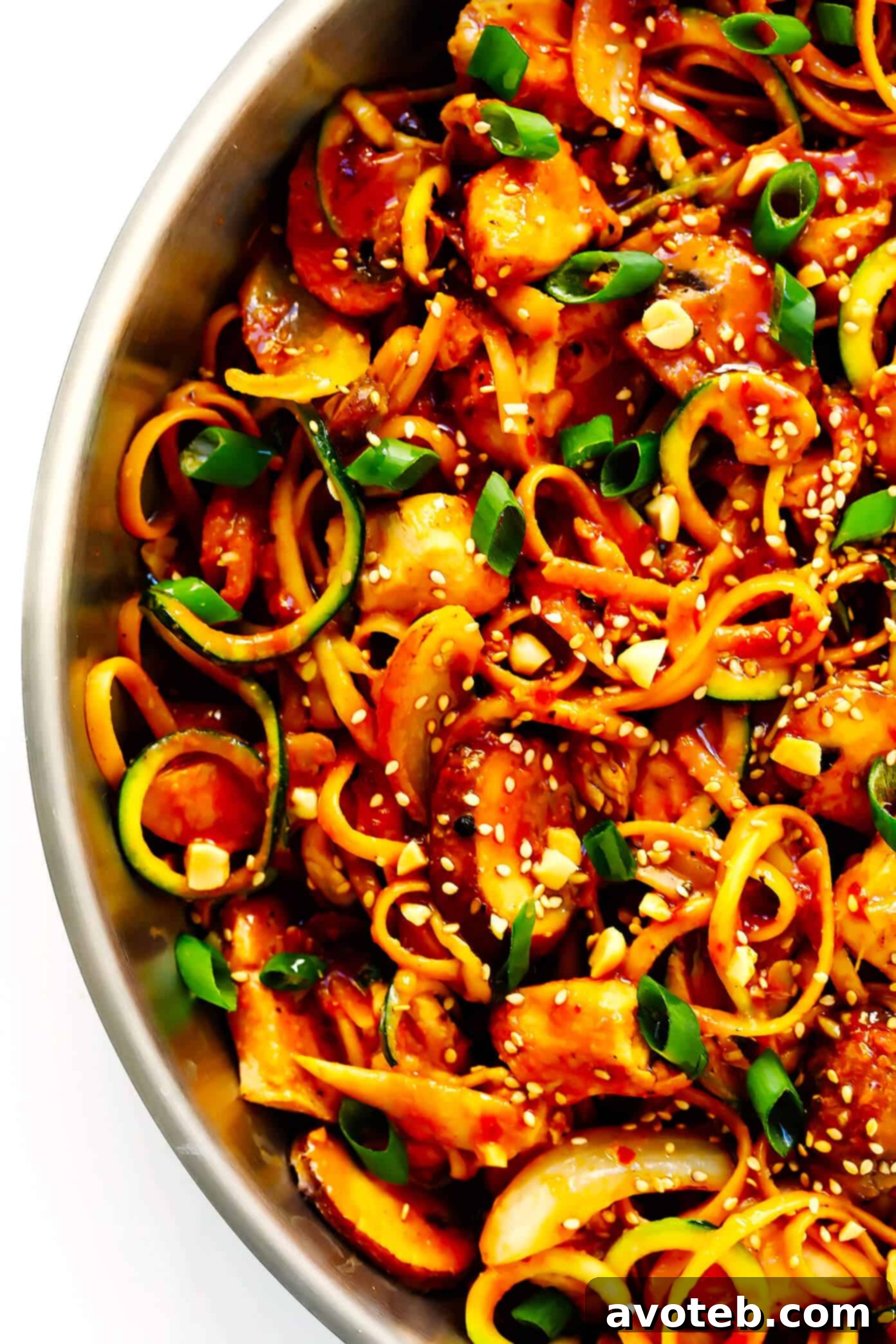 Serving Kung Pao Chicken Noodle Stir-Fry with toppings