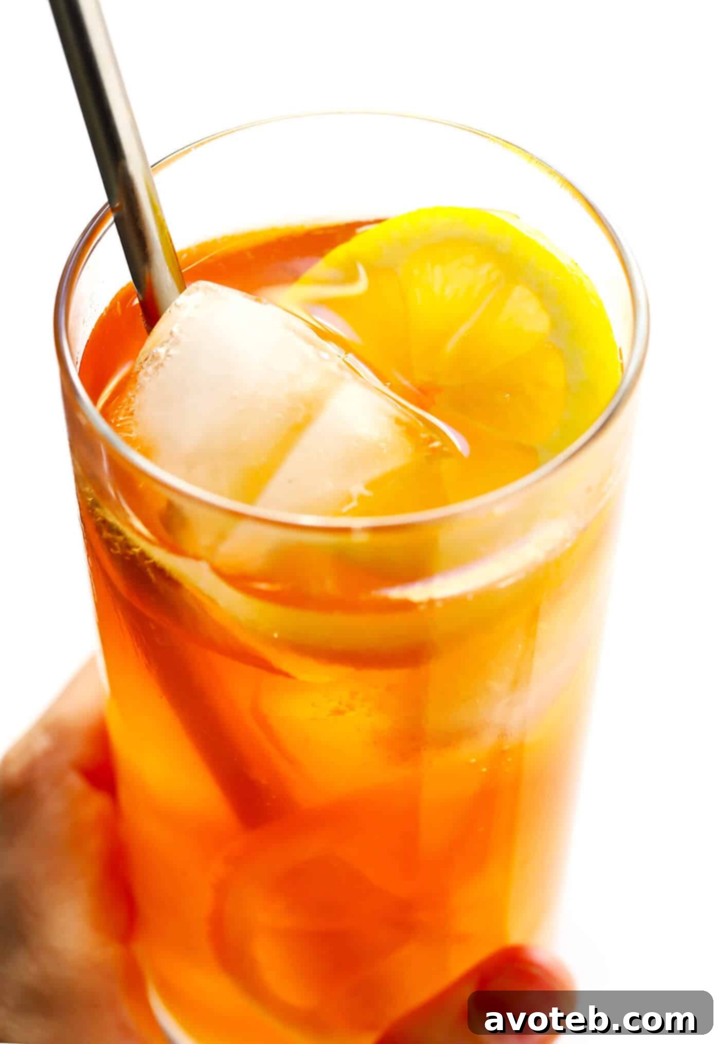 Close-up of a perfectly mixed Horsefeather Cocktail, garnished with fresh citrus.