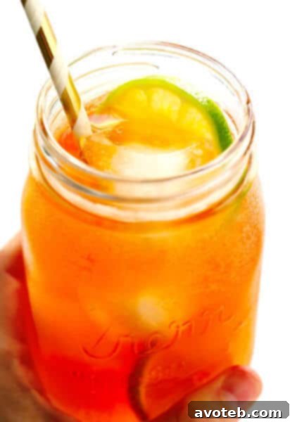 Classic Horsefeather Cocktail with lime garnish, a delightful whiskey and ginger beer drink.