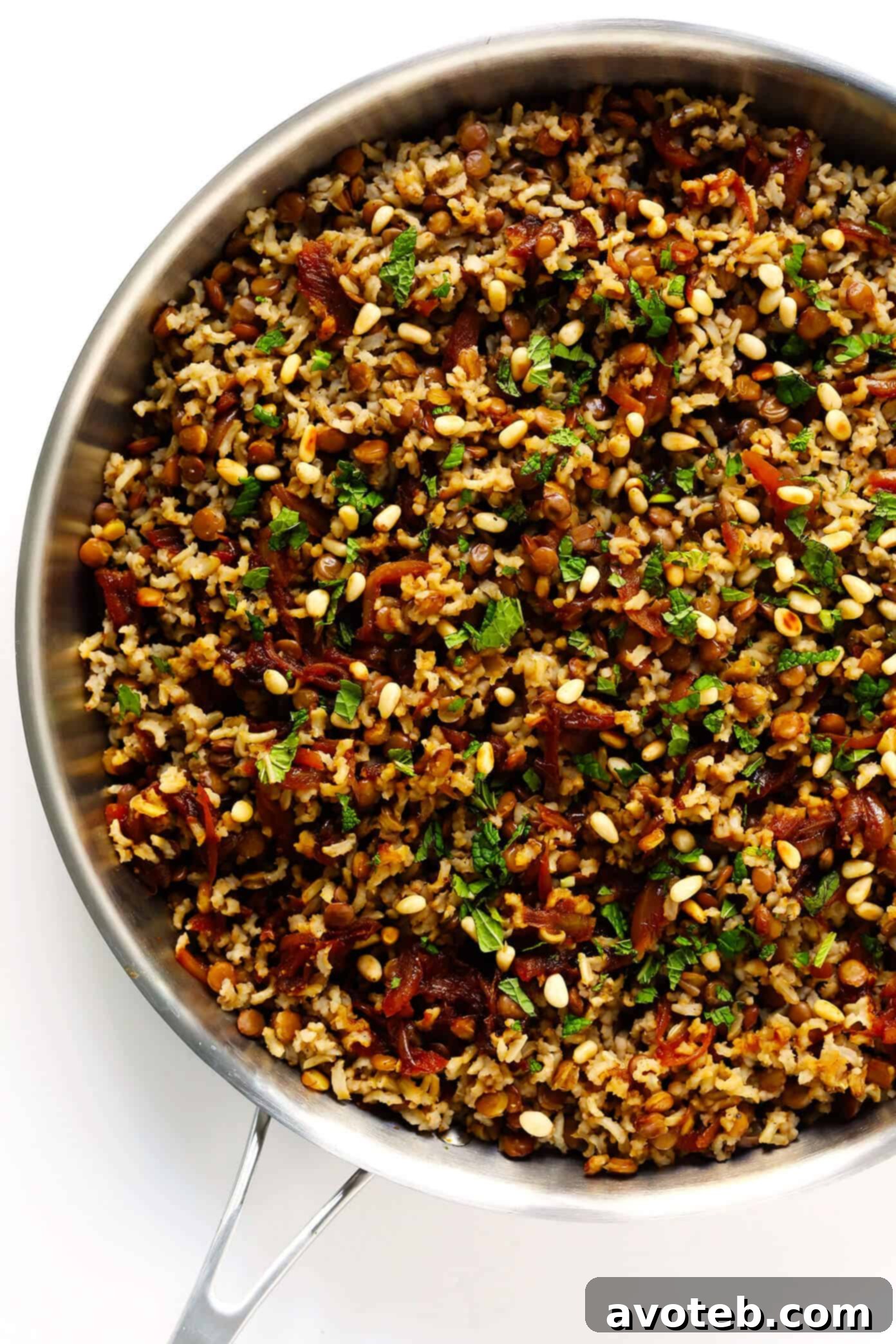 Wholesome Brown Rice Mujadara 5 Sliced onions caramelizing in a pan, turning golden brown.