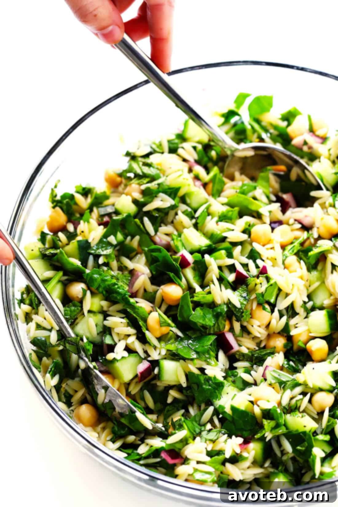 Close-up of Herb Lovers Lemony Orzo Pasta Salad, showing the vibrant colors of fresh ingredients and dressing.