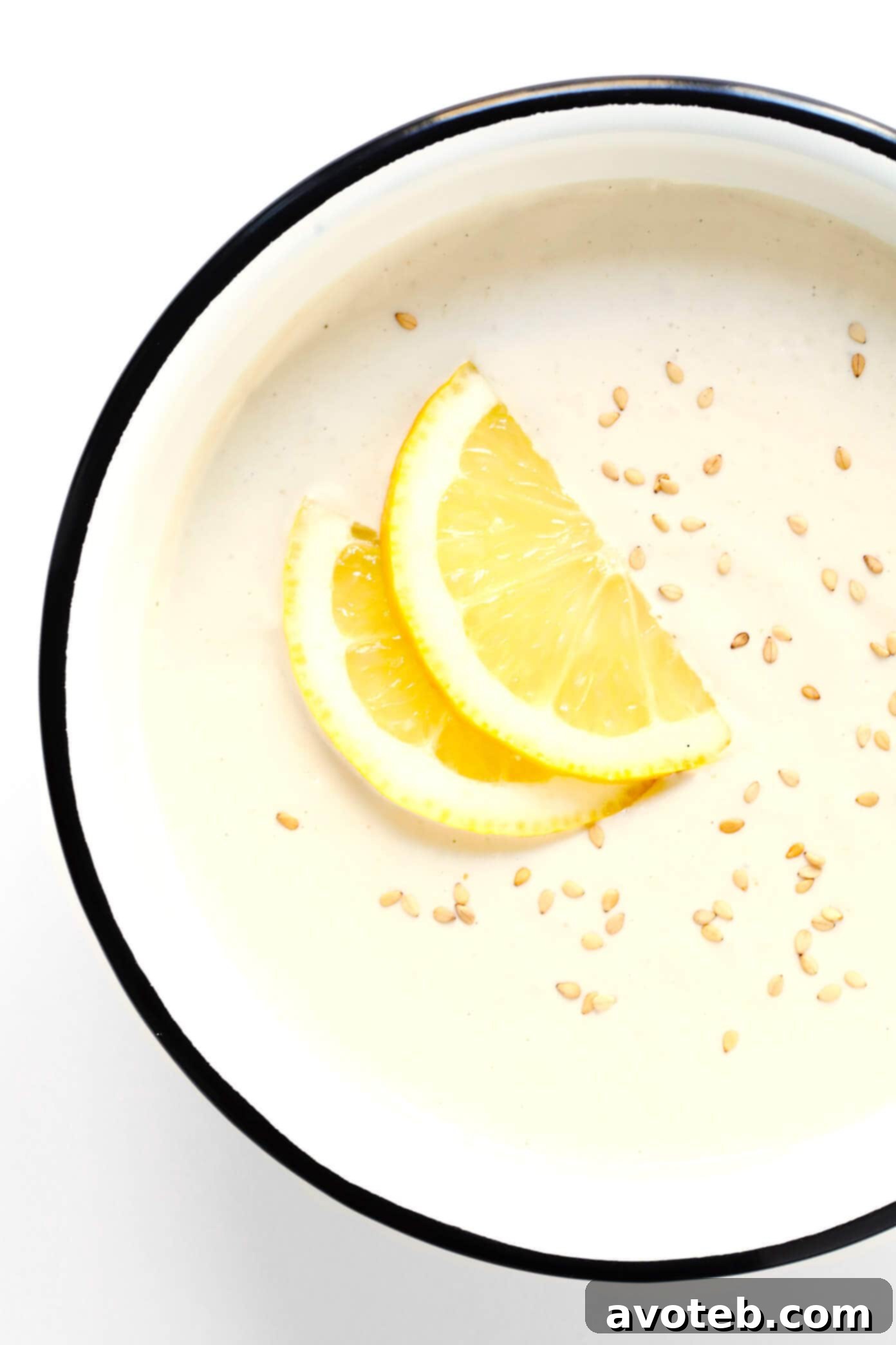 Blender Tahini Dip in a bowl sprinkled with sesame and lemon