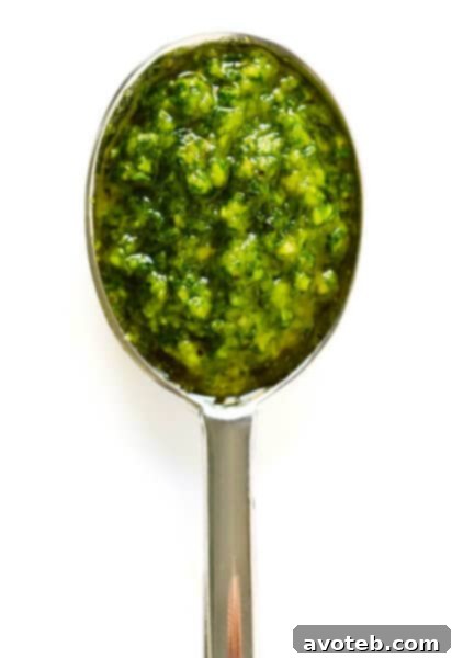 Pistachio Pesto in a bowl with ingredients around it