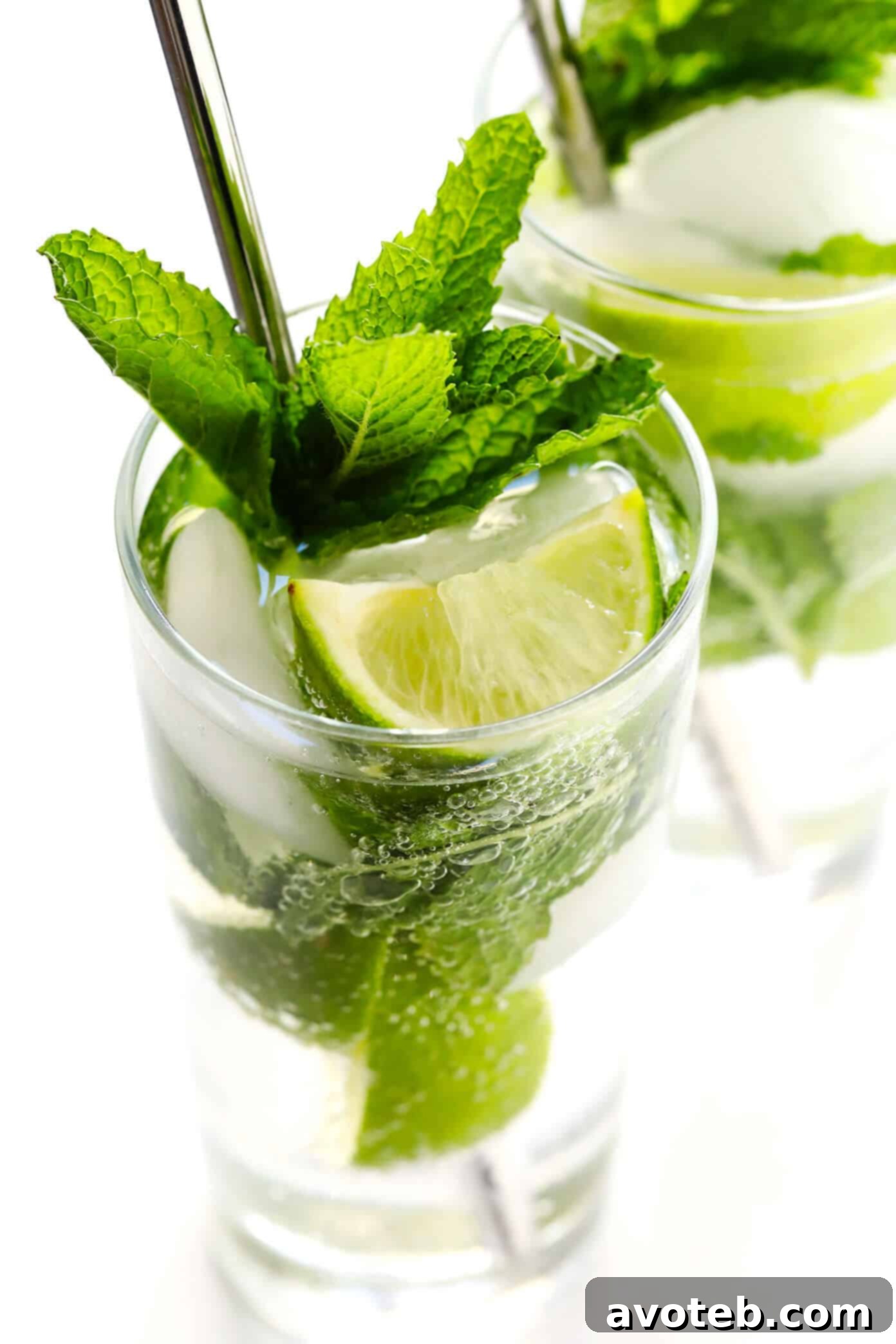 Truly the BEST mojito recipe! It's quick and easy to make with lots of fresh mint, lime juice and rum. It's naturally sweetened with honey. And easy to make in a single cocktail serving, or as a pitcher for a crowd. The perfect summer drink! | Gimme Some Oven #mojito #cocktail #drink #summer #recipe How To Make The Best Mojitos At Home