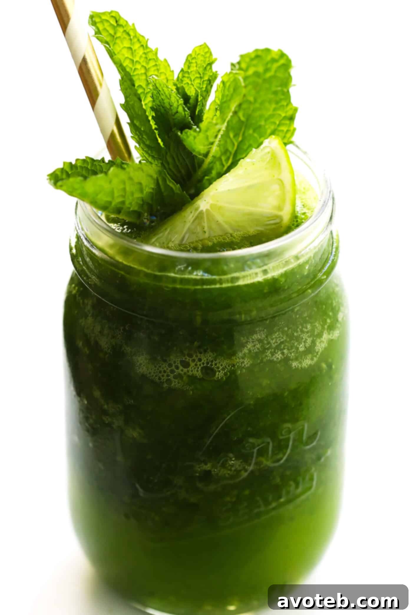 A close-up of a perfectly blended Frozen Mojito (Frojito) in a glass, ready for a hot summer day.