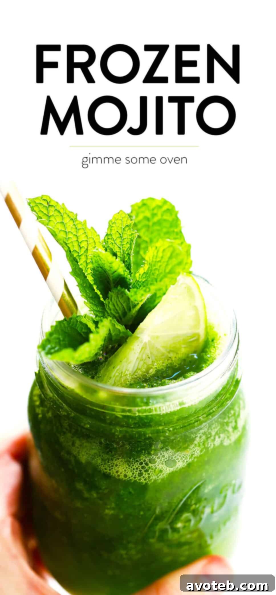 A large pitcher of Frozen Mojito (Frojito) next to a glass, garnished with mint and lime, perfect for sharing.