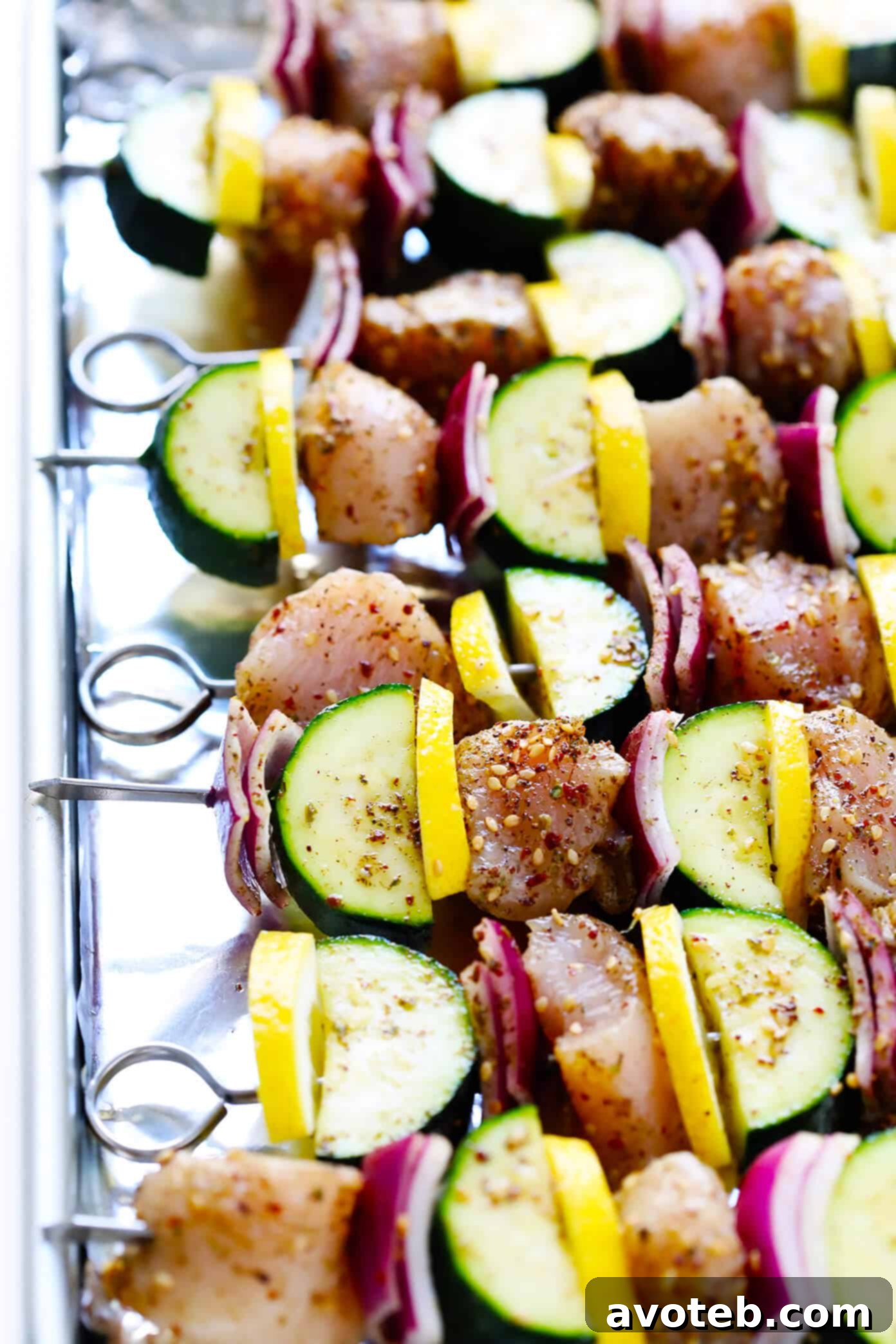 Close-up of uncooked Lemony Za'atar Chicken and Vegetable Kabobs.