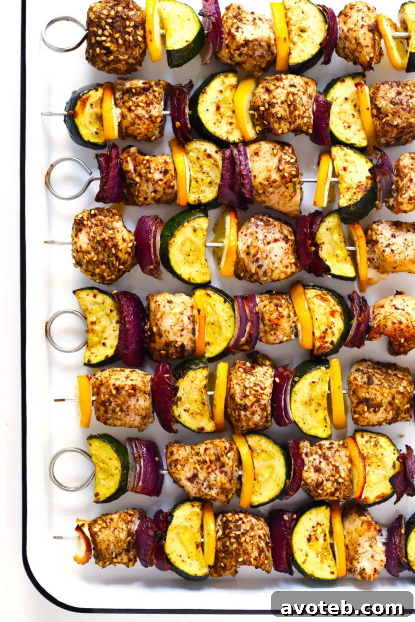 Beautifully plated Za'atar Chicken and Vegetable Kabobs with fresh herbs.