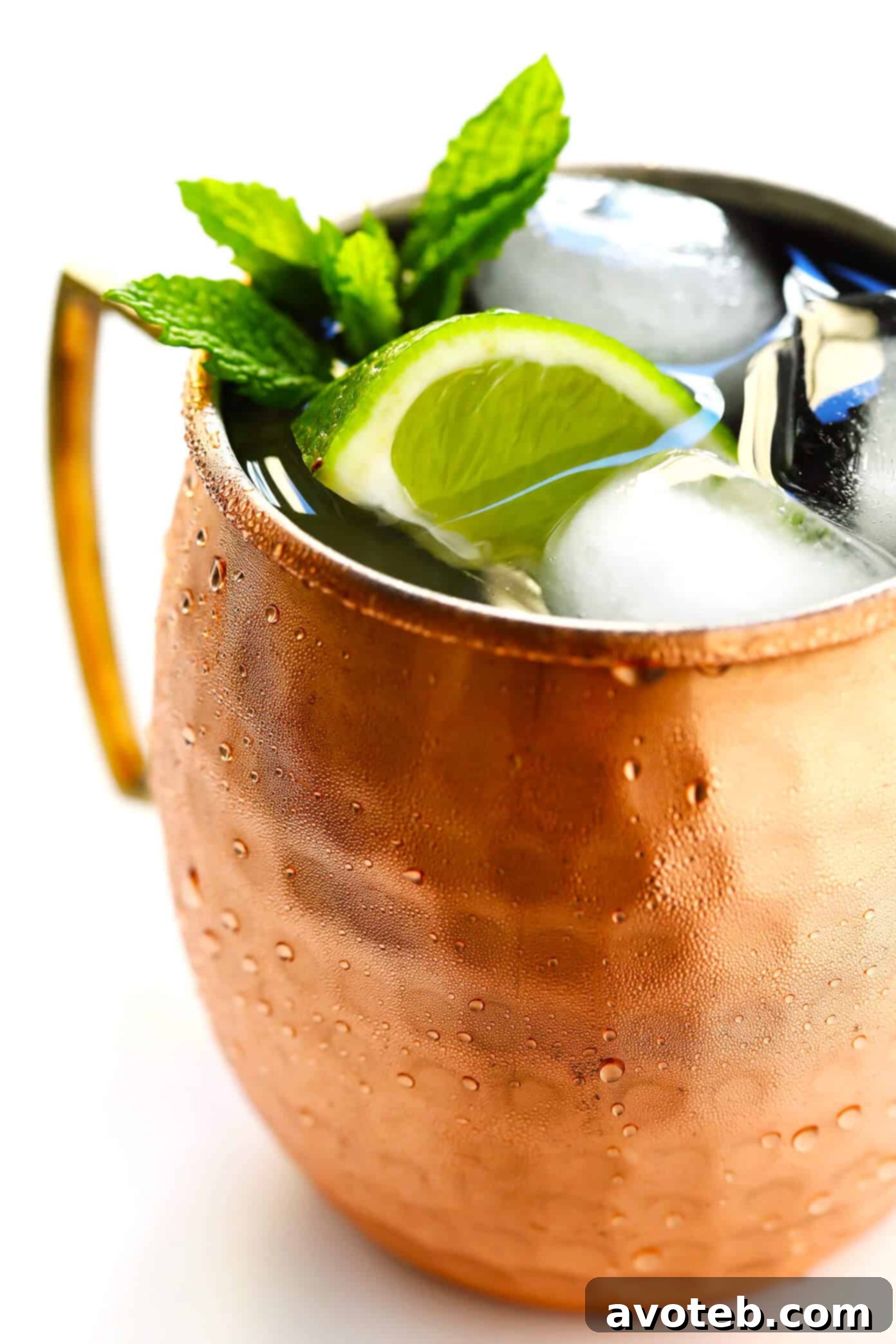 The Perfect Moscow Mule: A refreshing blend of ginger beer, lime, and vodka, garnished beautifully. Ideal for any occasion. | Gimme Some Oven #moscowmule #cocktailperfection #refreshingdrinks #summermule The Perfect Moscow Mule - Garnished with Lime and Mint