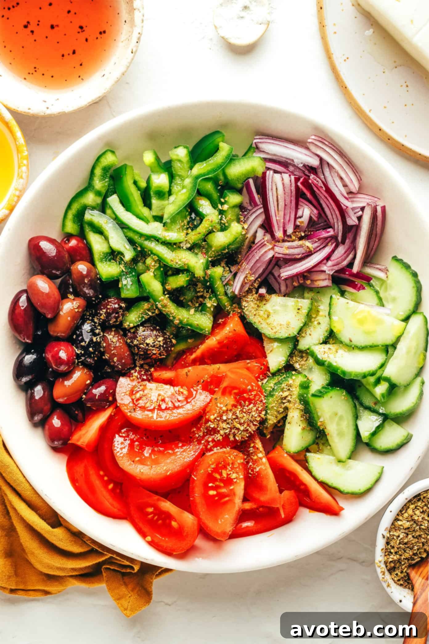 Ingredients for Greek salad laid out on a wooden table