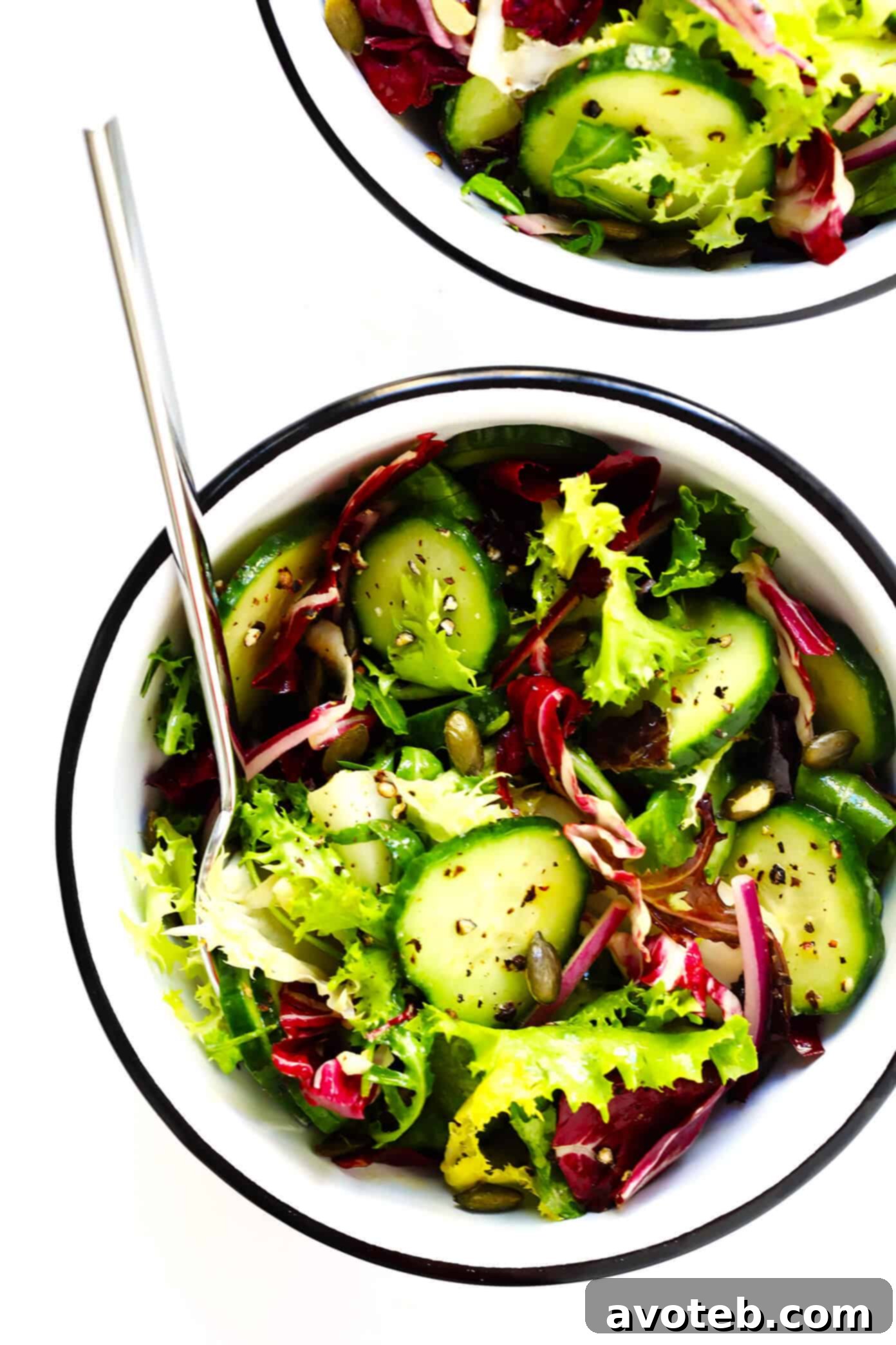 My favorite everyday salad recipe -- made with fresh greens, cucumber, red onion, pepitas, and a simple lemon salad dressing.