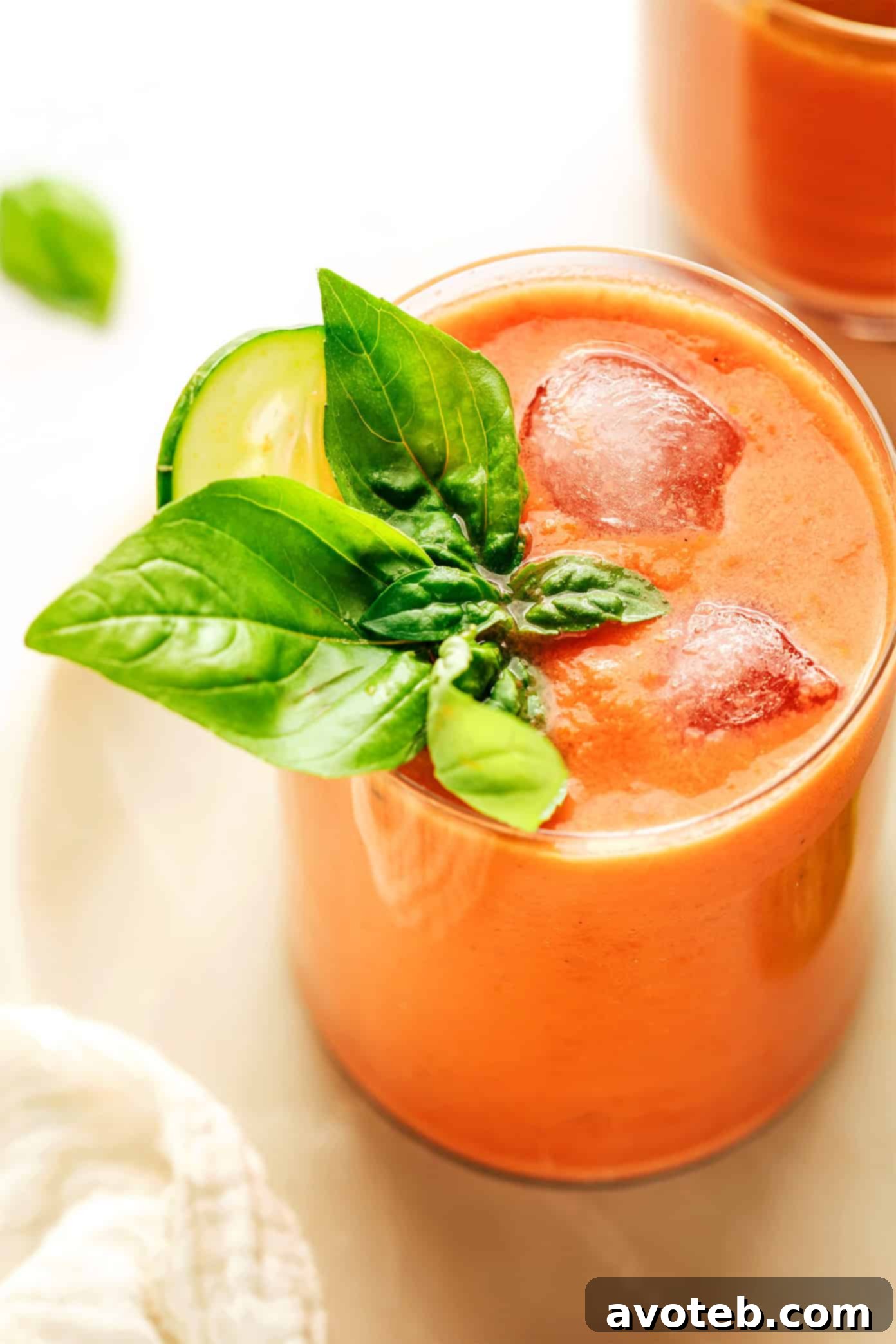 The Original Gazpacho 6 Two glasses of gazpacho served over ice with straws, a popular and refreshing way to enjoy the soup in Spain, especially in warm weather.