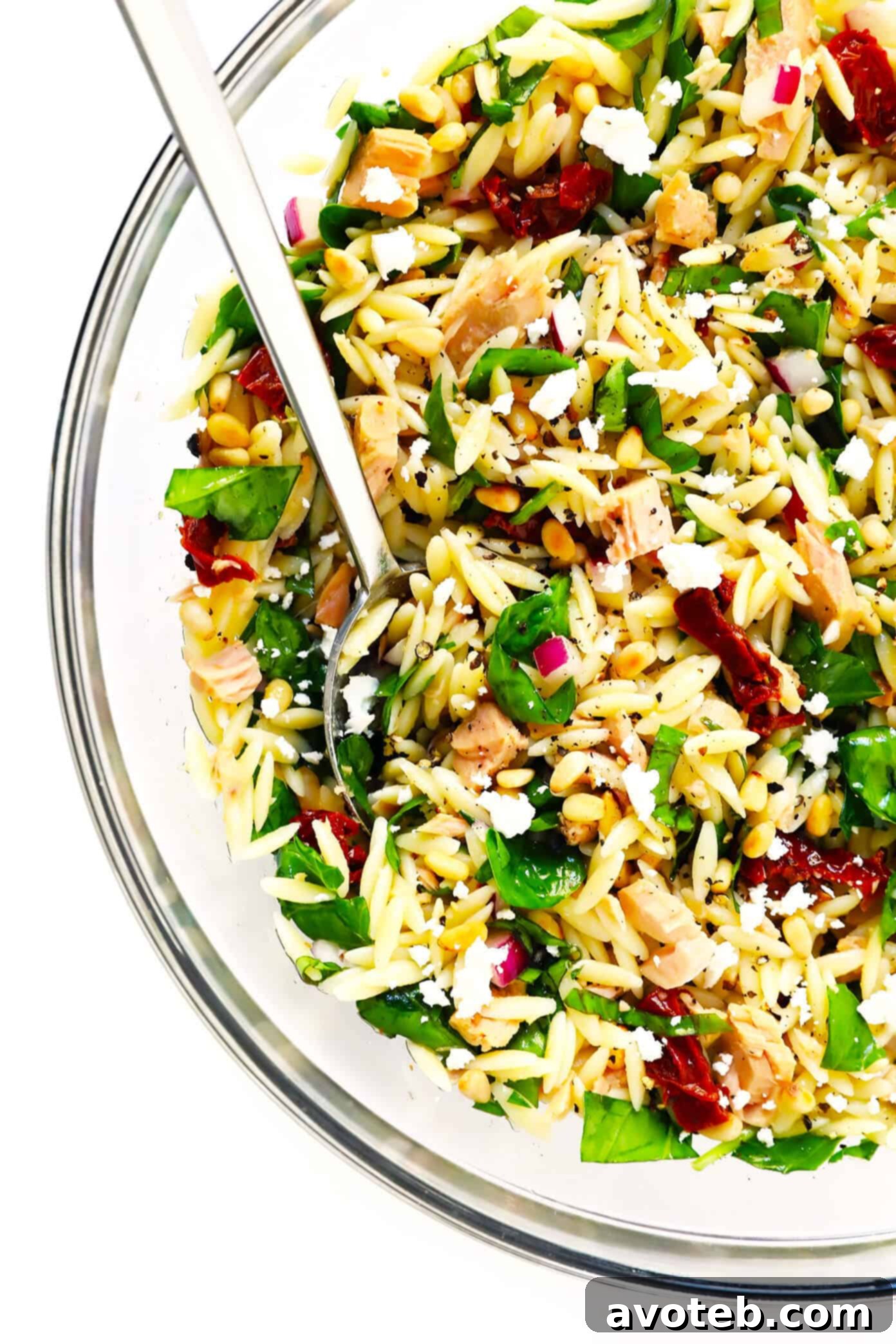 Delicious Italian Orzo Tuna Salad with Sun-Dried Tomatoes, Spinach and Feta ready to serve.