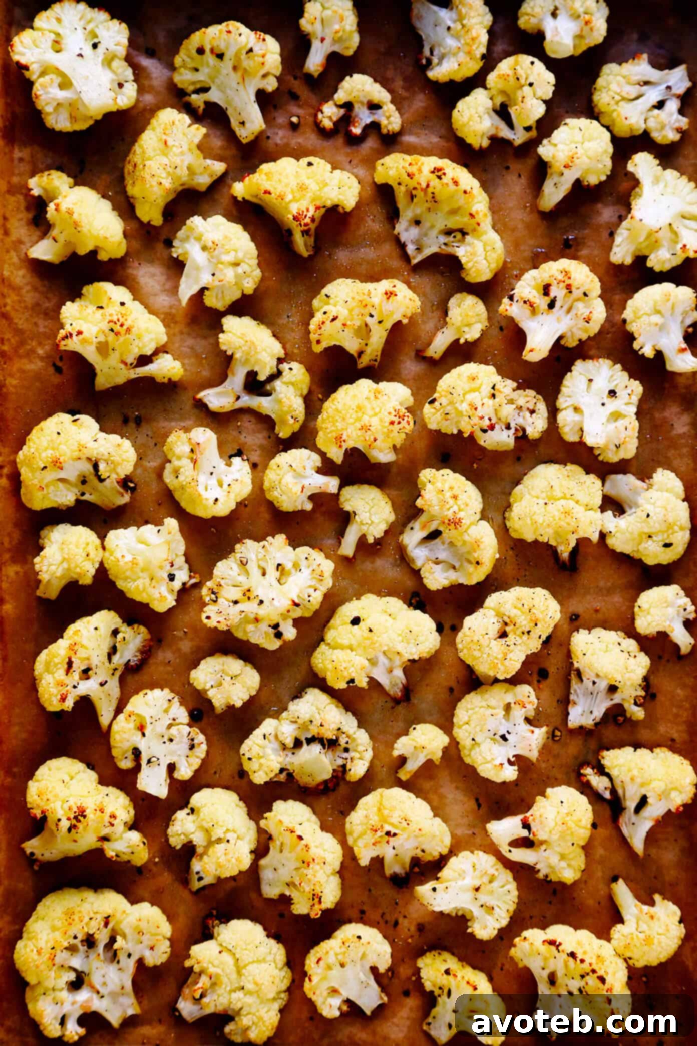 The BEST Roasted Cauliflower recipe -- super easy to make in the oven, naturally #glutenfree and #vegan, and easy to customize with any of your favorite seasonings. It's the perfect healthy side dish. Or perfect for adding to a salad, soup, pizza, dip, pasta, tacos or more! | Gimme Some Oven The BEST Roasted Cauliflower Recipe - Golden brown and tender