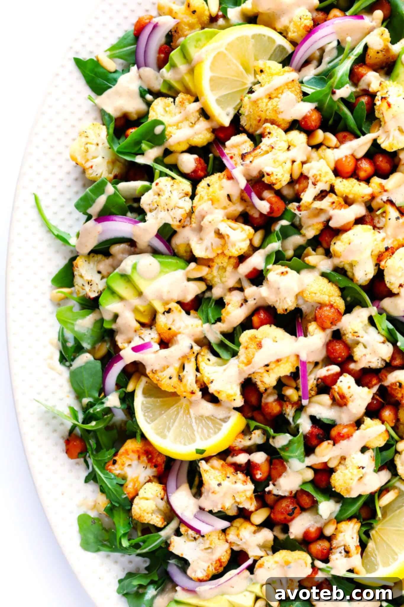 The BEST Roasted Cauliflower recipe -- super easy to make in the oven, naturally #glutenfree and #vegan, and easy to customize with any of your favorite seasonings. It's the perfect healthy side dish. Or perfect for adding to a salad, soup, pizza, dip, pasta, tacos or more! | Gimme Some Oven Roasted Cauliflower, Chickpea and Arugula Salad Recipe - A vibrant and healthy meal