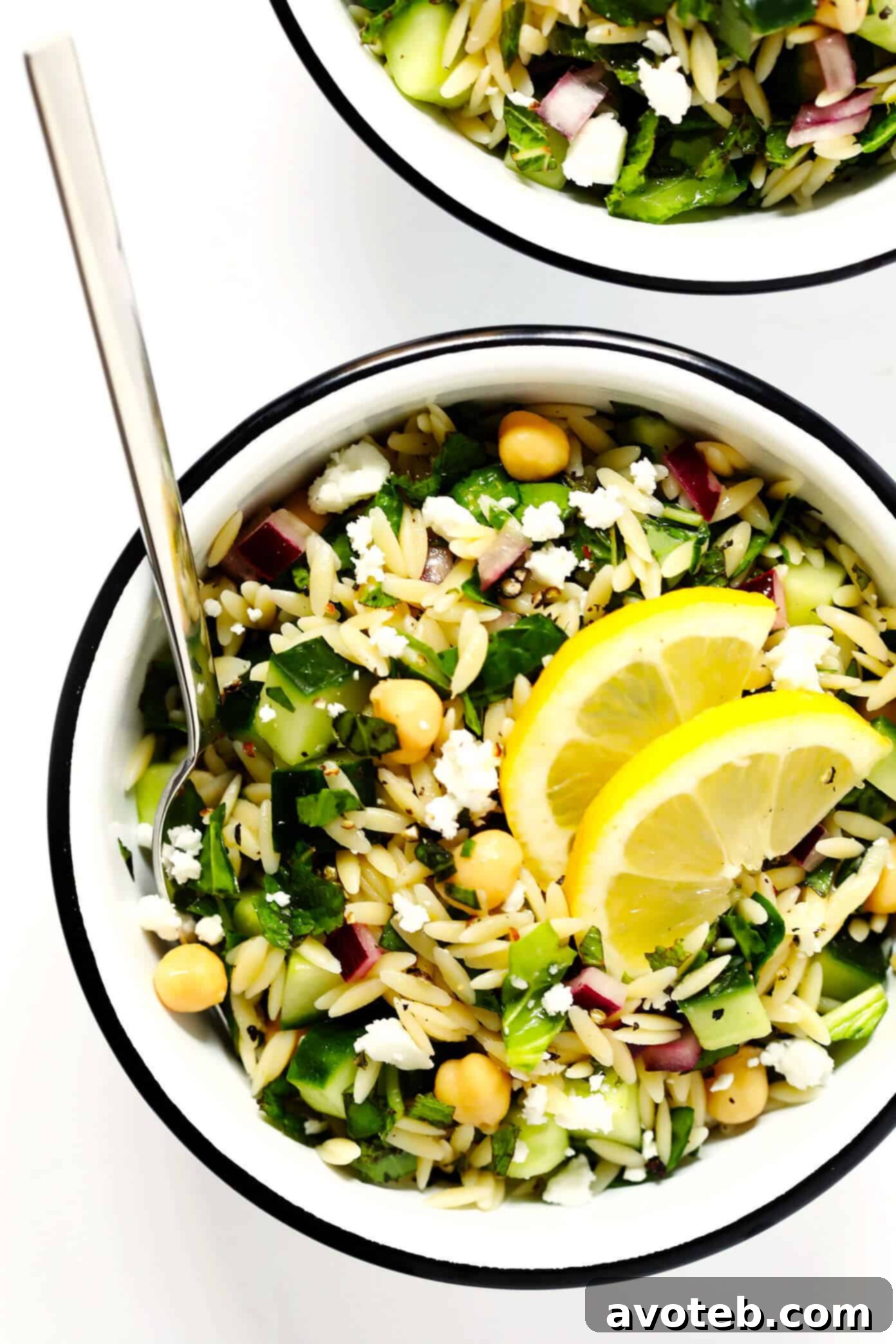 Herb-Lovers Lemony Orzo Salad: A fresh, vibrant, and naturally vegetarian (and vegan without cheese) pasta salad. Packed with basil, mint, cucumber, chickpeas, feta, and a zesty lemon dressing. Perfect for summer dinners and potlucks.