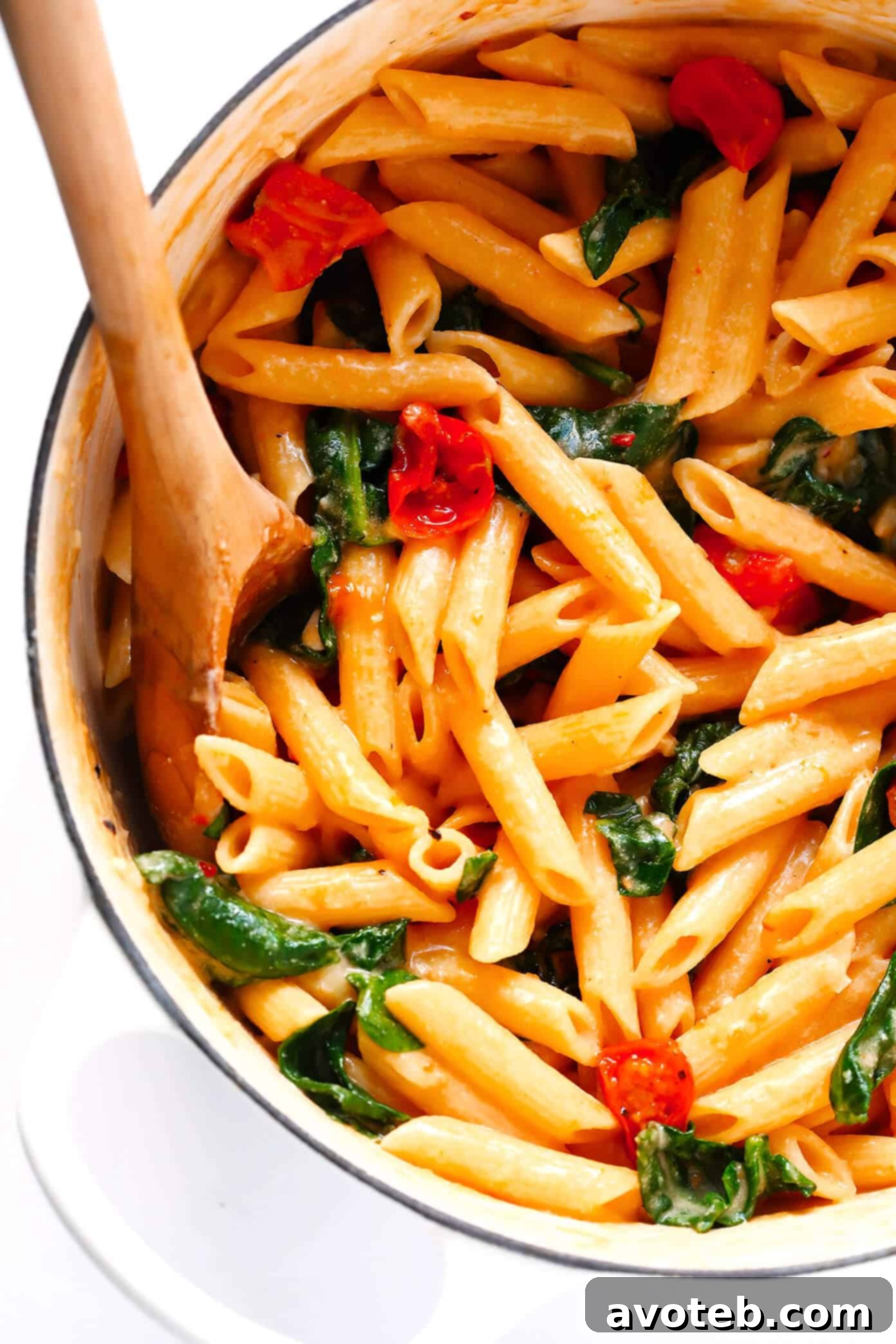 Creamy Rosé Pasta with Roasted Tomatoes: A comforting vegetarian pasta dish featuring juicy roasted tomatoes, fresh spinach, and a luscious, garlicky rosé wine sauce (made without heavy cream). Delicious and easy!