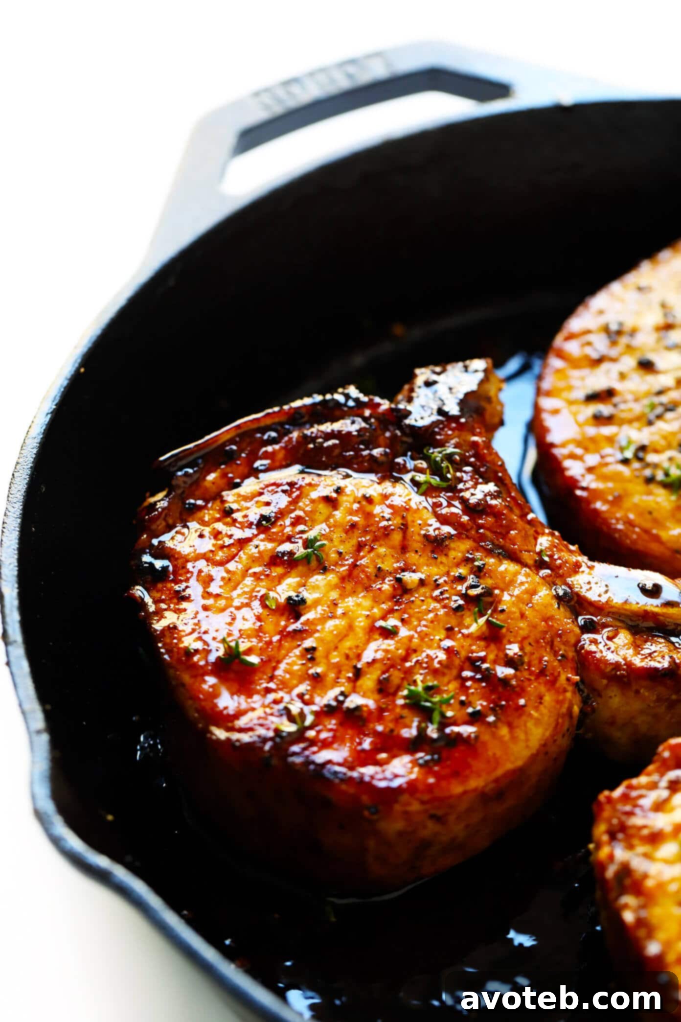 The BEST Baked Pork Chops recipe! It's quick and easy to make, totally customizable with your favorite seasonings, and perfectly seared on the outside and tender and juicy on the inside. | Gimme Some Oven #pork #baked #oven #dinner #glutenfree #meat The Best Baked Pork Chop Recipe served with lemon