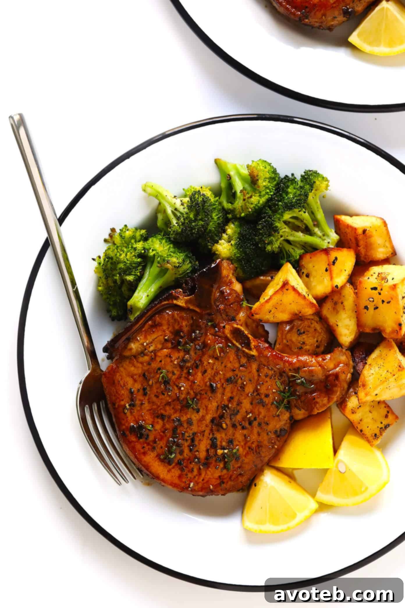 The BEST Baked Pork Chops recipe! It's quick and easy to make, totally customizable with your favorite seasonings, and perfectly seared on the outside and tender and juicy on the inside. | Gimme Some Oven #pork #baked #oven #dinner #glutenfree #meat Easy Baked Pork Chops Recipe with roasted vegetables