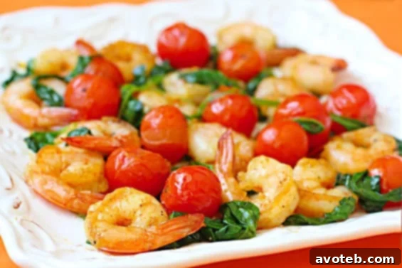 Sauteed Shrimp with Spinach & Tomatoes: A quick and healthy 15-minute meal featuring fresh produce.