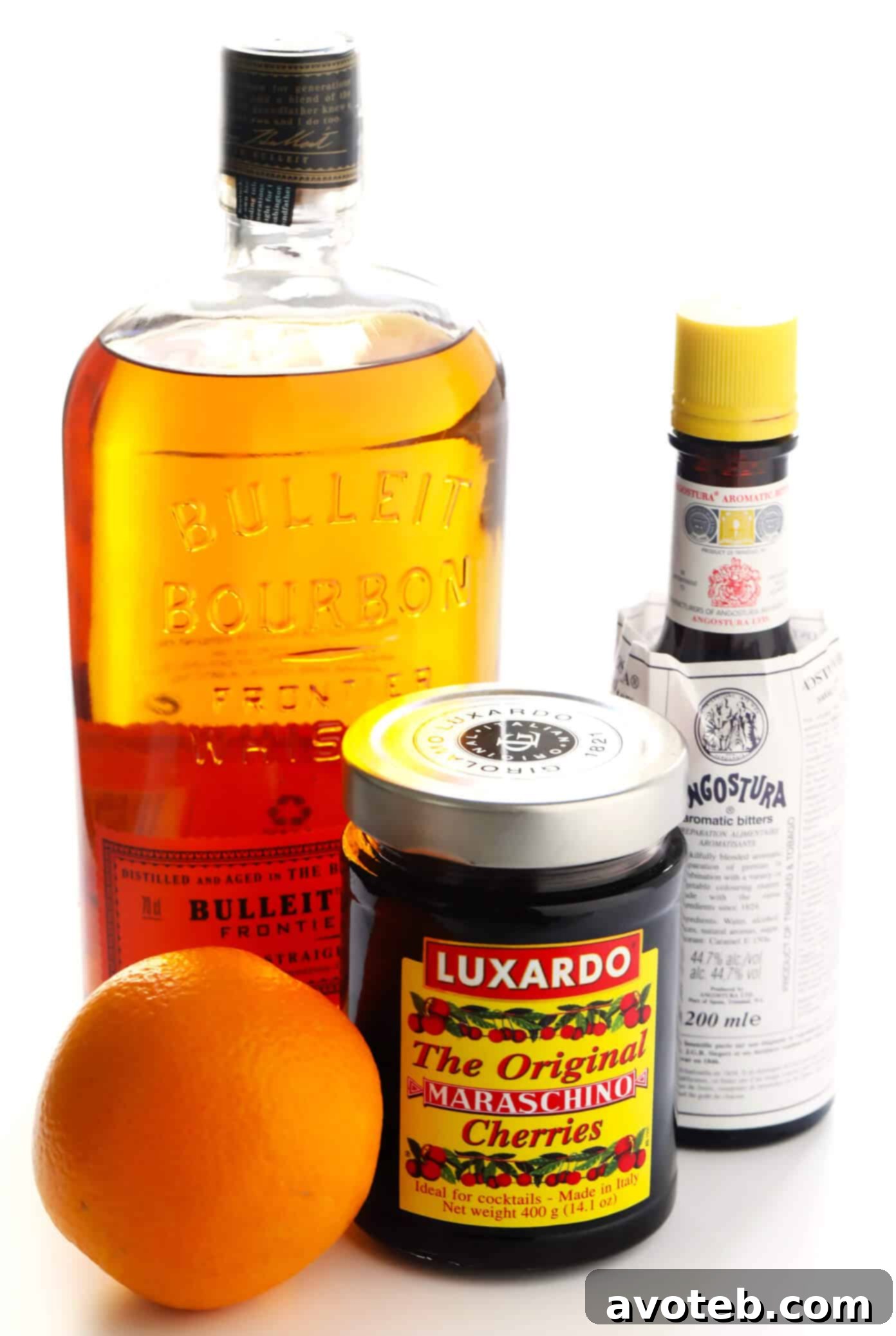 Maple Old Fashioned Cocktail Ingredients - Quality bourbon, bitters, fresh orange, and pure maple syrup for a perfect drink.