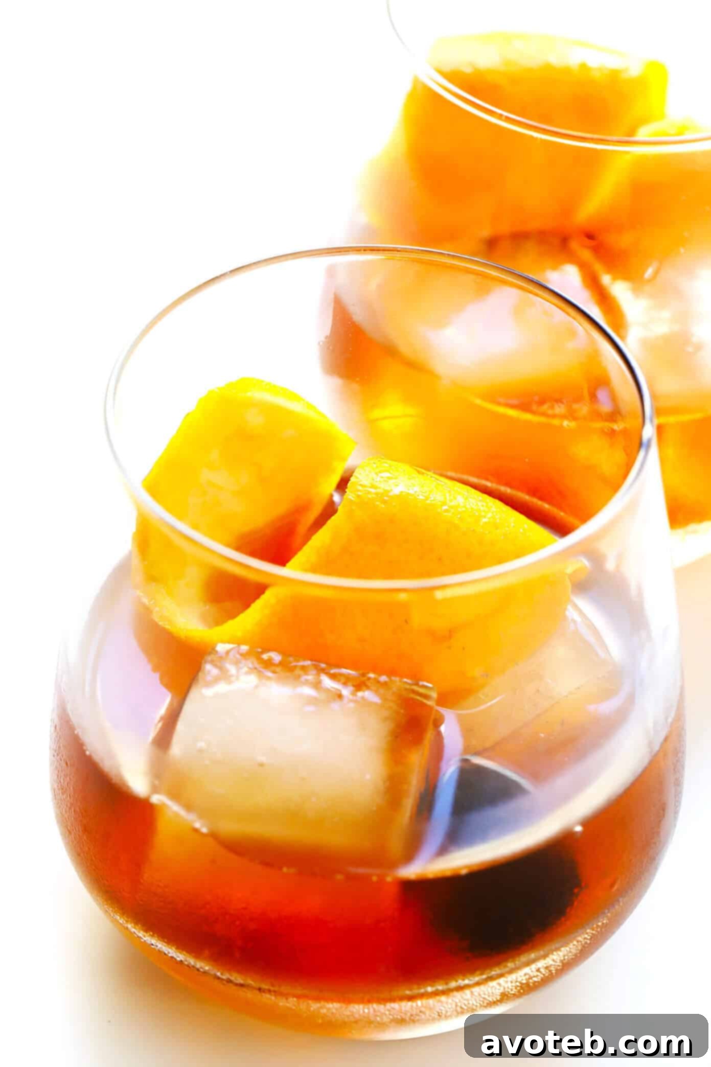 Maple Old Fashioned Cocktail Recipe - A finished bourbon drink with maple syrup, orange peel, and a Luxardo cherry.