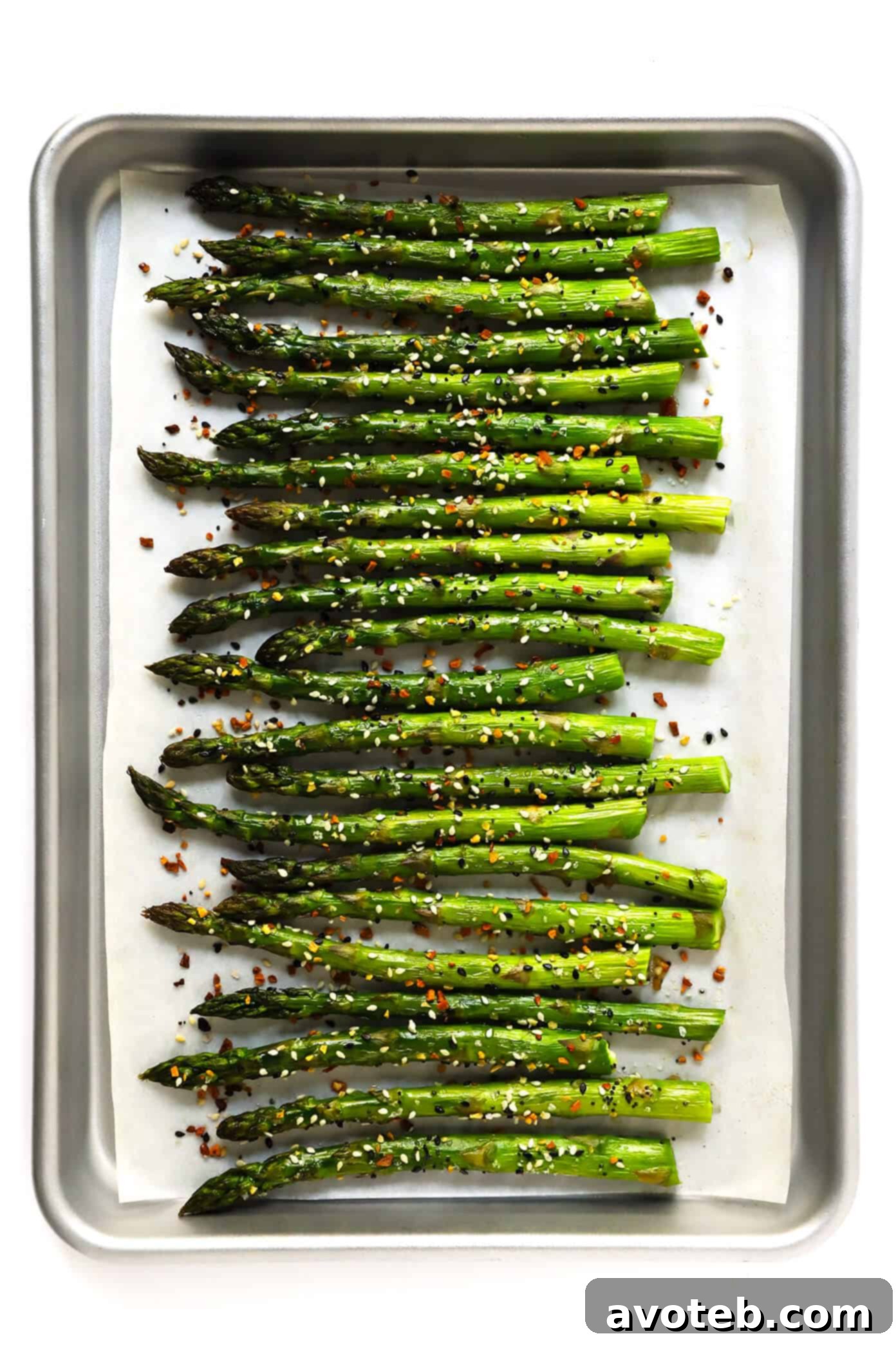 Kick your roasted asparagus recipe up a notch this season with some everything bagel seasoning! It's super quick and easy to make, naturally vegan and gluten-free, and makes the most delicious healthy side dish. | Gimme Some Oven #asparagus #side #vegetable #healthy #dinner #thanksgiving #christmas #holiday #fall #winter "Everything" Roasted Asparagus | Gimme Some Oven - a vibrant and crunchy healthy side dish.